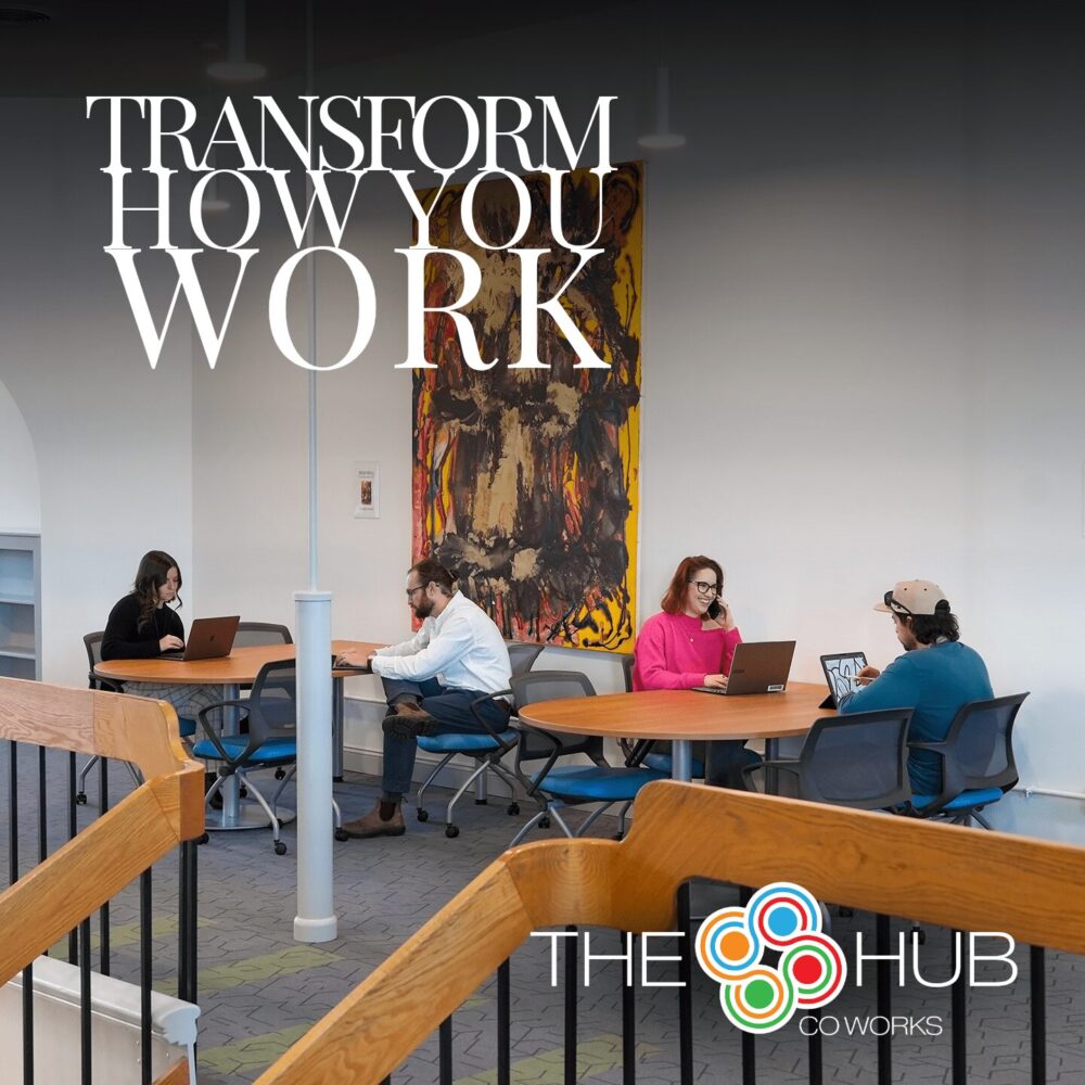 A promotional image featuring a modern coworking space with four people working at round tables, each using laptops and tablets. A bold white headline reads “Transform How You Work” at the top. The Hub CoWorks logo is positioned at the bottom right corner. The background includes contemporary art and a bright, inviting atmosphere.