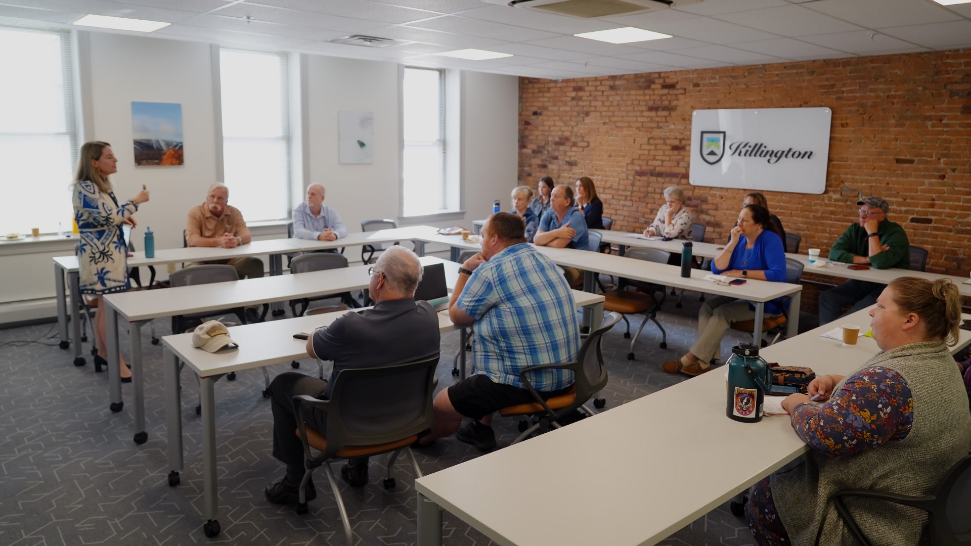 Mimi Damm speaking at one of her free digital marketing seminars held in the Killington room at The Hub CoWorks. This classroom styling meeting space is available for rent for your business meeting needs! The Cisco Webex Board Pro 75 Smart Board is great for hybrid meetings and presentations!