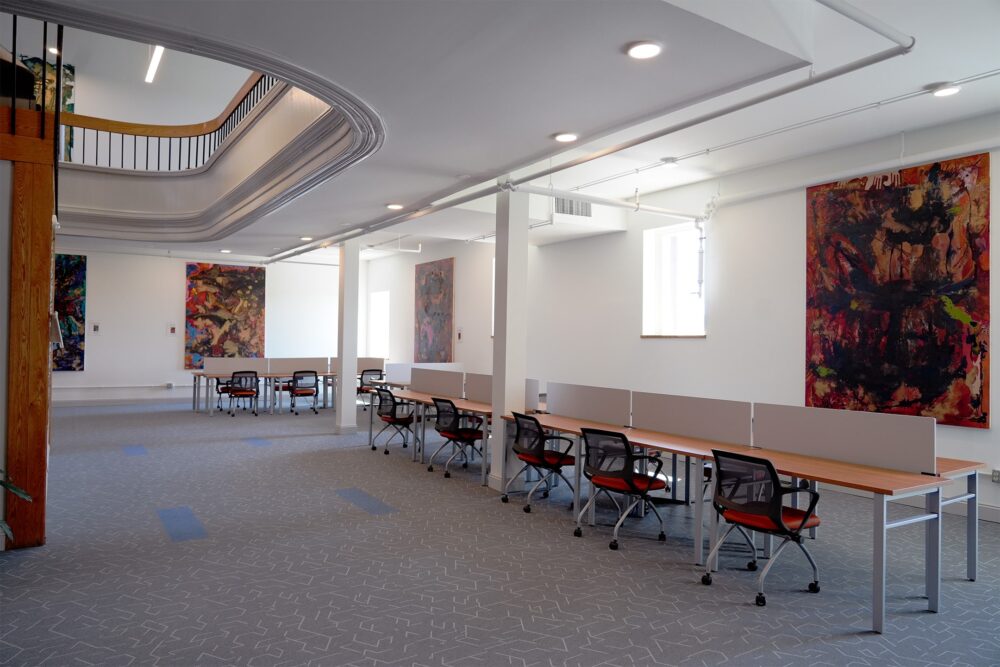The coworking space in the Opera House at The Hub CoWorks featuring ergonomic chairs, colorful art, and lots of natural light. Located in downtown Rutland, Vermont. It is a conveniently short drive from Castleton University and Killington Mountain Ski Resort.