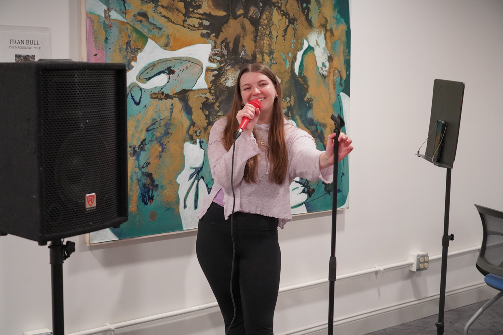 Cammy Errington performs at the November CEDRR Mixer at The Hub CoWorks