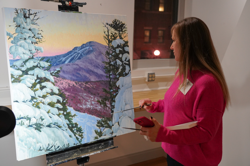 Carrie Pill paints at the November CEDRR Mixer at The Hub CoWorks