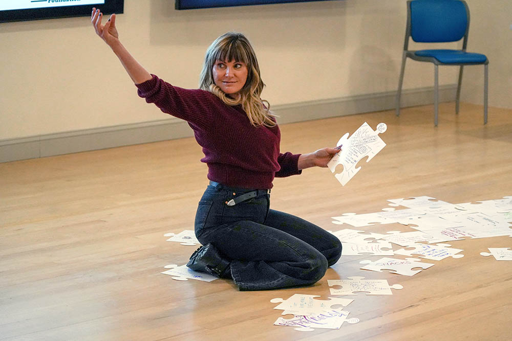 Grace Potter works to assemble a puzzle of arts resources at the Grand Point Foundation's Arts Community Symposium