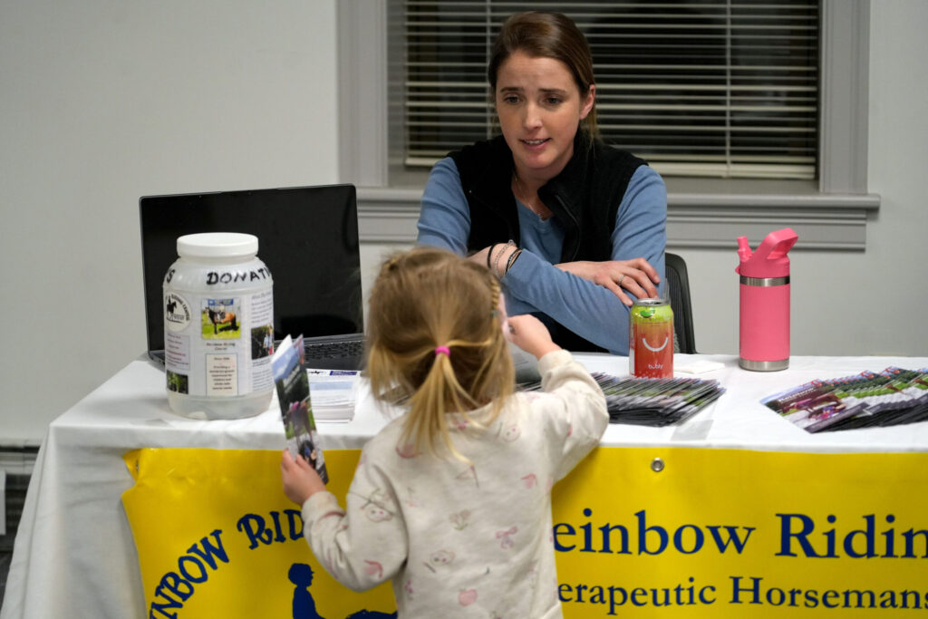A child interacts with a presenter at the Real Rutland Community Roundup