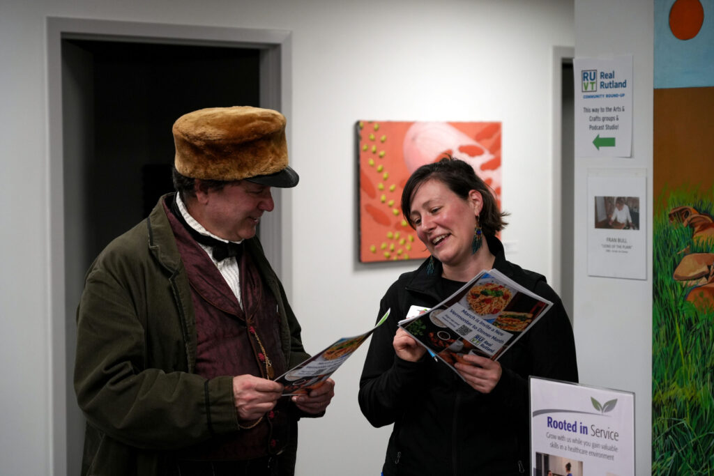 A presenter at the Real Rutland Community Roundup speaks Caitlin Gates, Real Rutland Concierge Coordinator